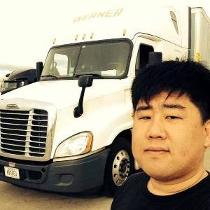Jim Cho Another CDS Graduate From Their Lakewood Campus Is Standing Next To His Werner Enterprise Truck.